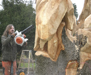Chainsaw sculptor Bruce 'Thor' Thorsteinson is turning a dead maple tree in Tacoma into a work of art. (PHOTO BY TODD MATTHEWS)