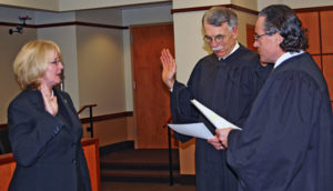 Pierce County Executive Pat McCarthy (left) was sworn in on Jan. 2, 2009, by Washington State Supreme Court Justice Charles W. Johnson (center) and (right) Pierce County Superior Court Judge John A. McCarthy. (PHOTO COURTESY PIERCE COUNTY)