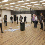 Spaceworks Tacoma Manager Heather Joy leads prospective tenants on a tour of 1120 Spaceworks, a new creative co-working space that will open in a commercial office building in downtown Tacoma. "The building is such a great opportunity for Spaceworks Tacoma because it's right downtown, it's so visible, and it's been vacant for so long," said Joy. "People are excited to hear Spaceworks is doing something like this." (PHOTO BY KRIS CREWS / COURTESY SPACEWORKS TACOMA)