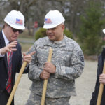 U.S. Rep. Denny Heck (D-Wash.) speaks with Col. Greg Allen and an official from Absher Construction. (PHOTO COURTESY WASHINGTON NATIONAL GUARD)