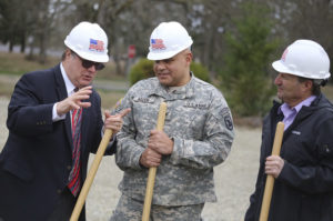 U.S. Rep. Denny Heck (D-Wash.) speaks with Col. Greg Allen and an official from Absher Construction. (PHOTO COURTESY WASHINGTON NATIONAL GUARD)