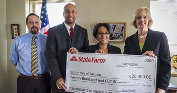 FROM LEFT TO RIGHT: City of Tacoma Contract and Program Auditor Christopher Wright, State Farm Insurance Agent Tony Brooks, Tacoma Mayor Marilyn Strickland, and State Farm Insurance Agent Wendi Thomas met this week at Tacoma City Hall to discuss State Farm Insurance's decision to award a $20,000 grant to the Summer Jobs 253 program. (PHOTO COURTESY CITY OF TACOMA)