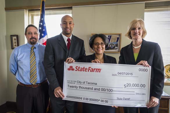 FROM LEFT TO RIGHT: City of Tacoma Contract and Program Auditor Christopher Wright, State Farm Insurance Agent Tony Brooks, Tacoma Mayor Marilyn Strickland, and State Farm Insurance Agent Wendi Thomas met this week at Tacoma City Hall to discuss State Farm Insurance's decision to award a $20,000 grant to the Summer Jobs 253 program. (PHOTO COURTESY CITY OF TACOMA)