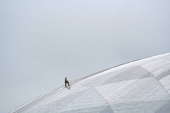 A contractor cleans the Tacoma Dome's roof three years ago after an anonymous donor paid approximately $104,000 for the service. (FILE PHOTO COURTESY KEVIN FREITAS)