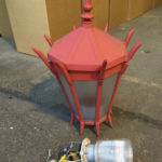 Dozens of red street lamps that once lined Tacoma's Lincoln International Business District were recently replaced with new light-emitting diode (LED) bulbs and fixtures. The old fixtures have been re-packaged and are being offered up for donation by the City of Tacoma. (PHOTO COURTESY CITY OF TACOMA)