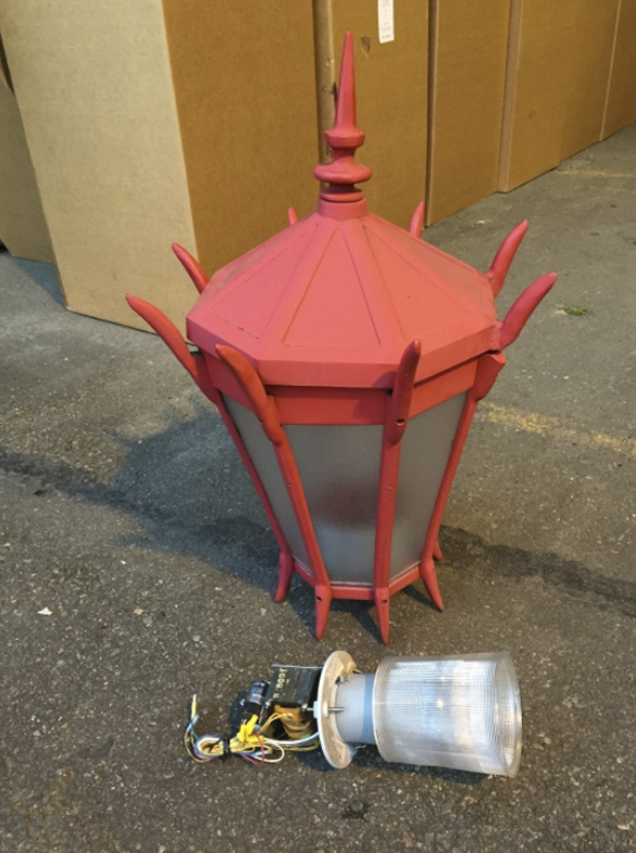 Dozens of red street lamps that once lined Tacoma's Lincoln International Business District were recently replaced with new light-emitting diode (LED) bulbs and fixtures. The old fixtures have been re-packaged and are being offered up for donation by the City of Tacoma. (PHOTO COURTESY CITY OF TACOMA)