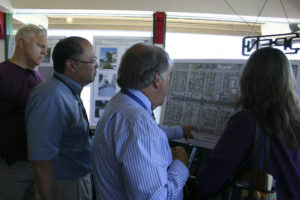 City of Tacoma Project Manager Tom Rutherford (center) discusses the Lincoln Neighborhood Revitalization Project with local stakeholders during an open house on Thursday in Tacoma. (PHOTO BY TODD MATTHEWS)