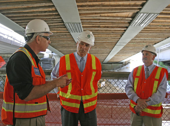 Washington State Governor Jay Inslee (center) toured the construction site for the new State Route 167 Puyallup River Bridge on May 27. Atkinson Construction Senior Vice President Bob Adams (left) and Washington State Department of Transportation (WSDOT) Region Administrator Kevin Dayton (right) explained some of the challenges of constructing the new $31.2 million bridge. (PHOTO COURTESY WSDOT)