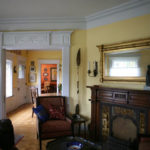 The Mead House living room includes a fire place that was salvaged from the former Hewitt House. (PHOTO COURTESY SUSAN JOHNSON / ARTIFACTS CONSULTING)