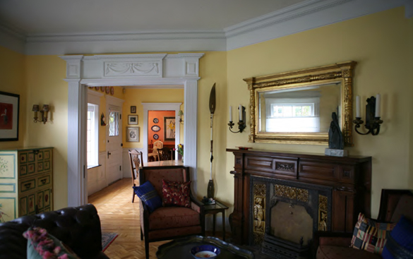 The Mead House living room includes a fire place that was salvaged from the former Hewitt House. (PHOTO COURTESY SUSAN JOHNSON / ARTIFACTS CONSULTING)