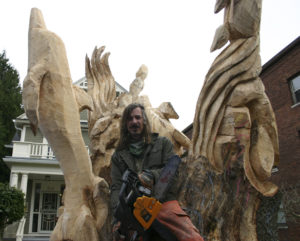 Local painter, illustrator, and chainsaw sculptor Bruce 'Thor' Thorsteinson was hired last year to turn a dead maple tree in Tacoma into a work of art. (FILE PHOTO BY TODD MATTHEWS)