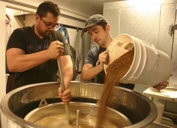 Jesse Dunagan (right) and Jon Russell prepare an Irish stout at Dunagan Brewing Co. in downtown Tacoma. (PHOTO BY TODD MATTHEWS)