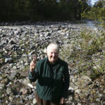 Barbara Reid in the heart of Vancouver Notch, the confluence of the Mowich River (on her left) and the Puyallup River (on her right). (PHOTO BY TODD MATTHEWS)