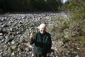 Barbara Reid in the heart of Vancouver Notch, the confluence of the Mowich River (on her left) and the Puyallup River (on her right). (PHOTO BY TODD MATTHEWS)