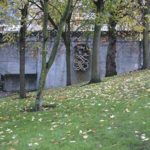 Harold Balazs's "Untitled (Concrete Sculpture)" is seen through the trees at Bicentennial Pavilion in downtown Tacoma. Citing safety concerns, the City of Tacoma plans to remove the 40-year-old sculpture. (PHOTO BY TODD MATTHEWS)