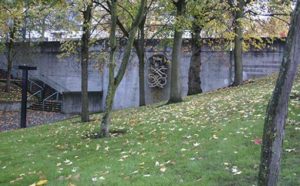 Harold Balazs's "Untitled (Concrete Sculpture)" is seen through the trees at Bicentennial Pavilion in downtown Tacoma. Citing safety concerns, the City of Tacoma plans to remove the 40-year-old sculpture. (PHOTO BY TODD MATTHEWS)