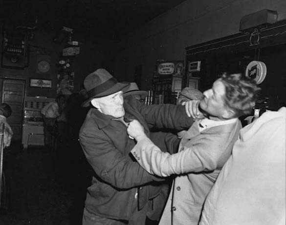Elmer Ogawa captured the action as two men brawled in a 1950s-era Seattle tavern. (ELMER OGAWA PHOTOGRAPH / COURTESY UNIVERSITY OF WASHINGTON LIBRARIES SPECIAL COLLECTIONS)