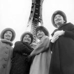 Japanese American Seafair royalty pose in front of the Space Needle, still under construction, in Seattle on Nov. 18, 1961. (ELMER OGAWA PHOTOGRAPH / COURTESY UNIVERSITY OF WASHINGTON LIBRARIES SPECIAL COLLECTIONS)