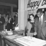 Fans line up for a piece of cake to celebrate local boxer Eddie Cotton on June 15, 1967, in honor of his 41st birthday. (ELMER OGAWA PHOTOGRAPH / COURTESY UNIVERSITY OF WASHINGTON LIBRARIES SPECIAL COLLECTIONS)