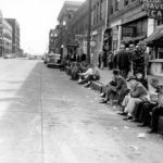 A scene outside Seattle's Occidental Tavern Cafe circa 1952. (ELMER OGAWA PHOTOGRAPH / COURTESY UNIVERSITY OF WASHINGTON LIBRARIES SPECIAL COLLECTIONS)