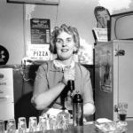 A bartender at Seattle's Bohemian Club Tavern circa 1956. (ELMER OGAWA PHOTOGRAPH / COURTESY UNIVERSITY OF WASHINGTON SPECIAL COLLECTIONS)