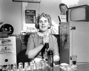 A bartender at Seattle's Bohemian Club Tavern circa 1956. (ELMER OGAWA PHOTOGRAPH / COURTESY UNIVERSITY OF WASHINGTON SPECIAL COLLECTIONS)