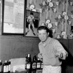 A bartender (and former boxer) at Seattle's Banquet Tavern circa 1952. (ELMER OGAWA PHOTOGRAPH / COURTESY UNIVERSITY OF WASHINGTON SPECIAL COLLECTIONS)