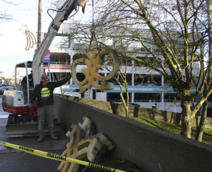 Contractors on Wednesday removed a downtown Tacoma art installation created 40 years ago by Pacific Northwest artist Harold Balazs. A City of Tacoma staff report recently noted the artwork was unstable and posed a safety hazard. (PHOTO BY TODD MATTHEWS)