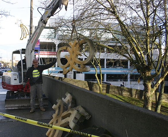 Contractors on Wednesday removed a downtown Tacoma art installation created 40 years ago by Pacific Northwest artist Harold Balazs. A City of Tacoma staff report recently noted the artwork was unstable and posed a safety hazard. (PHOTO BY TODD MATTHEWS)