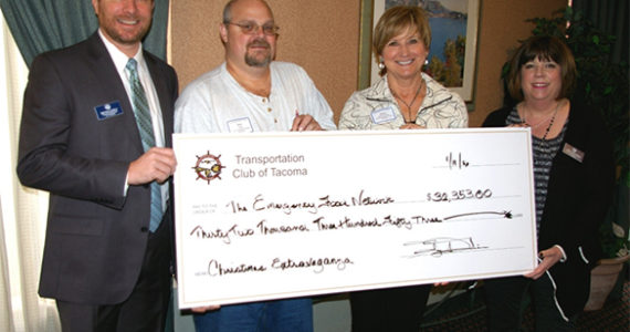 The Transportation Club of Tacoma recently donated more than $32,000 to the Emergency Food Network of Pierce County. Transportation Club of Tacoma President Bryan Lovely (far left) and and Transportation Club of Tacoma Director Lori Kincannon (far right) presented a check to Emergency Food Network Operations Manager Ken Hess and Emergency Food Network Executive Director Helen McGovern-Pilant earlier this month. (PHOTO COURTESY EMERGENCY FOOD NETWORK)