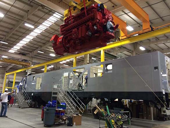 The first new Cummings engine is lowered into a Siemens Charger locomotive body. (PHOTO COURTESY WSDOT)