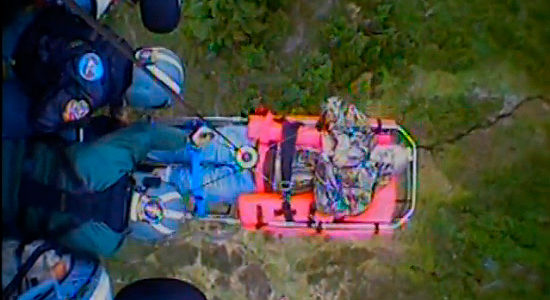 U.S. Coast Guard crewmen from Air Station Astoria hoist an injured hiker onto their MH-60 Jayhawk helicopter, Monday, July 19, 2016. Credit: USCG.