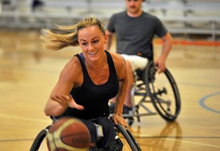 Megan Blunk, Gig Harbor, practices with the Metro Parks Tacoma Titans wheel chair basketball team. Credit: Metro Parks
