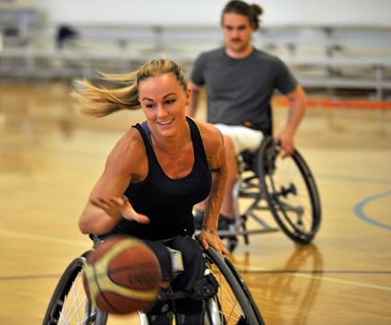 Megan Blunk, Gig Harbor, practices with the Metro Parks Tacoma Titans wheel chair basketball team. Credit: Metro Parks