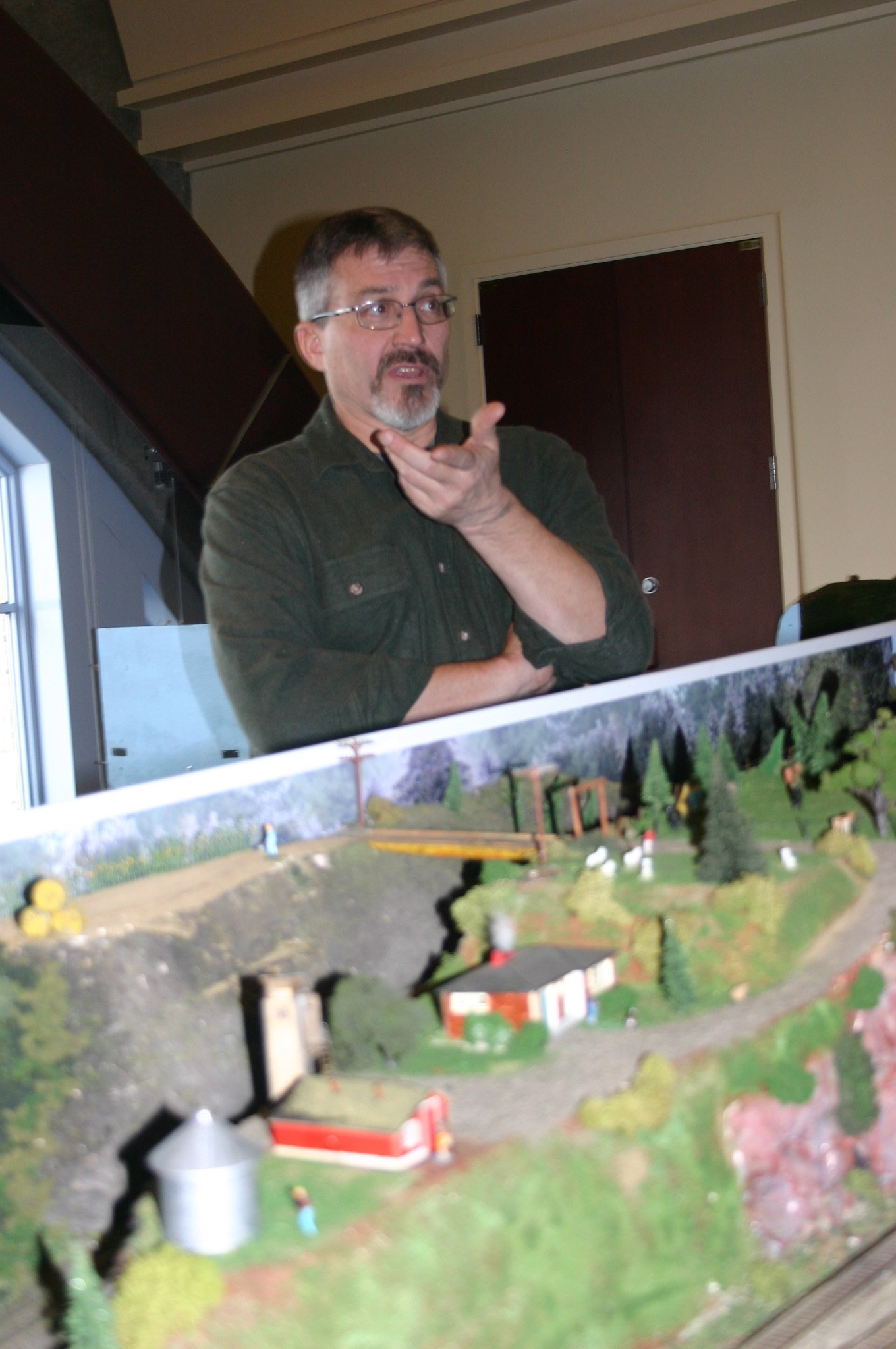 Steve Cox, Puyallup, discusses the Tacoma Northwestern Model Railroad Club's layout for the Model Train Festival at the Washington State History Museum. Credit: David Guest / TDI