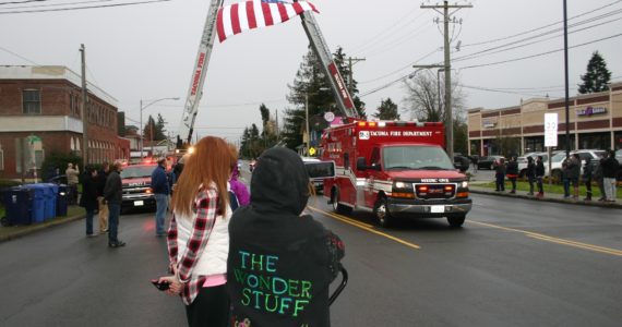 Credit: David Guest / TDIPeople line South Sprague Ave., Friday, Dec. 2, to pay their respects to Tacoma Police Officer Jake Gutierrez, who was shot to death on Dec. 1 while responding to a domestic violence call.