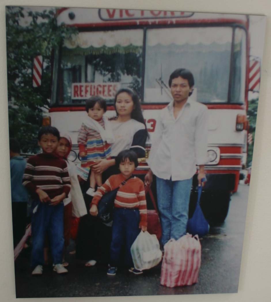 photo courtesy Ruoth Thach and family; in front of the bus that would take them from Thailand to the Philippines