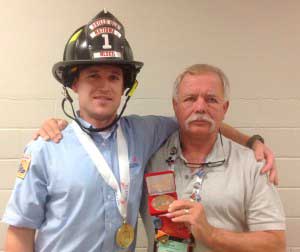 First Place gold medal winner Fire Service student Dallin Wilson (L) poses next to Fire Service Chief Pat Piper (R), who attended the national event with Wilson.Photo courtesy Bates Technical College