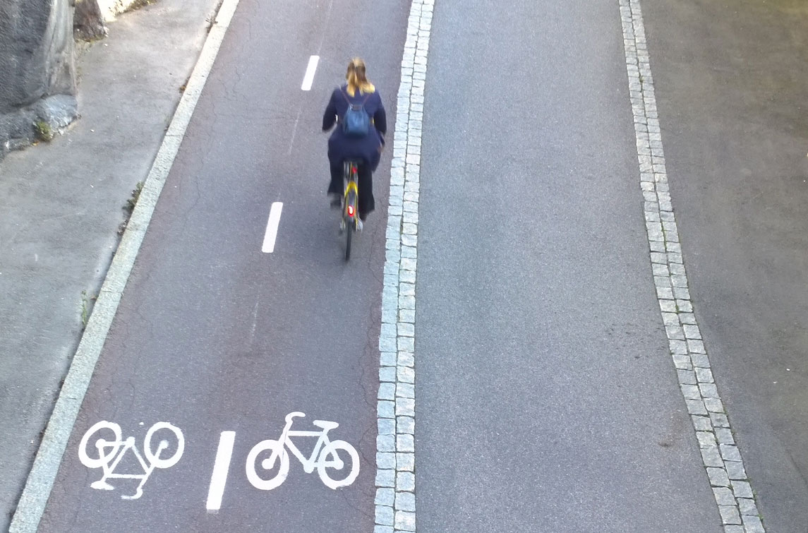 This bike "highway" in Copenhagen has directional lanes for bikes and a separate lane for non-bicycle pedestrian use - walkers, skaters, baby-strollers or wheelchairs.       Photo: Morf Morford