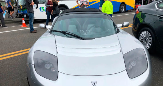 It looks like electric cars are here. This Tesla and all-electric bus just might be the future of transportation. Photo: Morf Morford