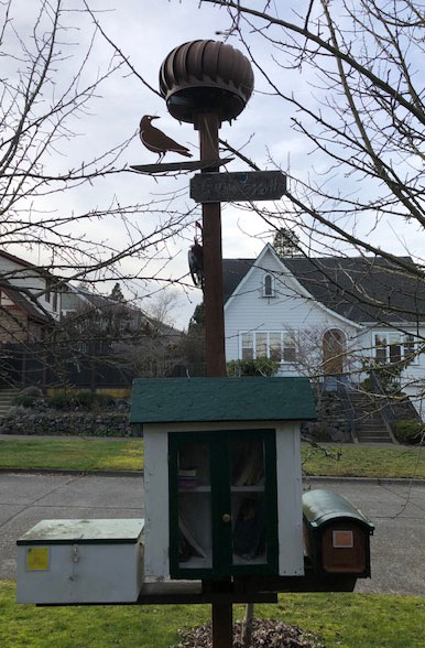 Not all Little Libraries are as elaborate as this one. The white box is for "treasures", the mailbox on the right is for poems, stories or "true confessions". Photo: Morf Morford