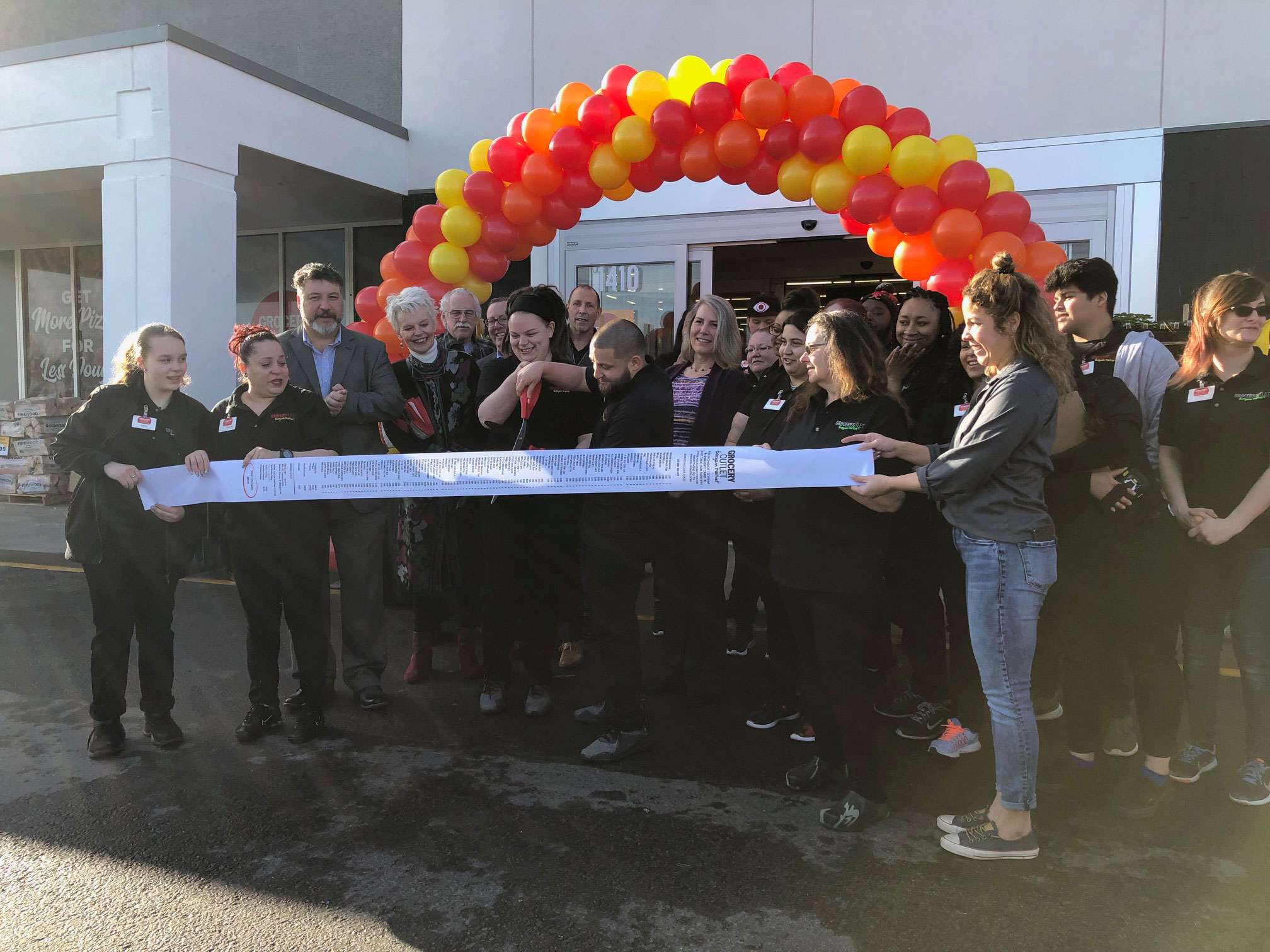 A variety of community representatives were on hand to welcome a new store - and employer to East Tacoma. Photo: Morf Morford