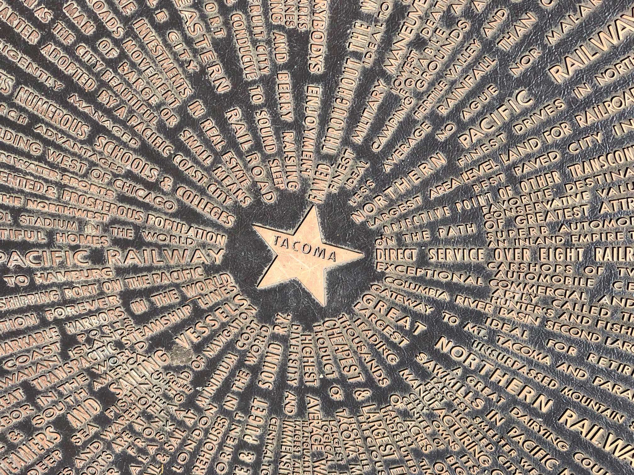 As this "Star of Destiny" by Allen C. Mason (embedded in the sidewalk in the Proctor District) implies, Tacoma is the center of commerce and culture of Pierce County. Thanks to the rails, trails, produce and work of all the surrounding communities, we all prosper. Photo: Morf Morford