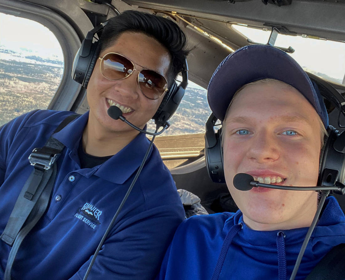 Image: Rainier Flight Service Flight Instructor and Museum of Flight Aeronautical Science Pathway graduate Christian Canlas (left) with currently-enrolled ASP student Stephen Green on one of Green’s first instructional flights. The photo was taken just before wearing face masks became the norm. Photo Stephen Green; Courtesy Museum of Flight