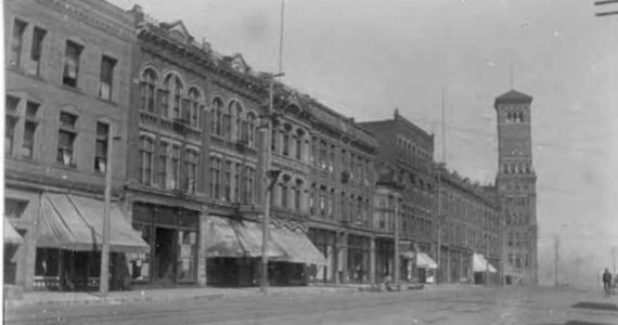 These buildings on the west side of Pacific Avenue have barely changed in over one hundred years; yes, that’s Old City Hall at the end. (Photo courtesy of Tacoma Public Library)
