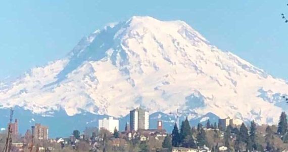 The mountain can be seen in the distance from Seattle. It hovers over Tacoma. (Photo by Morf Morford)