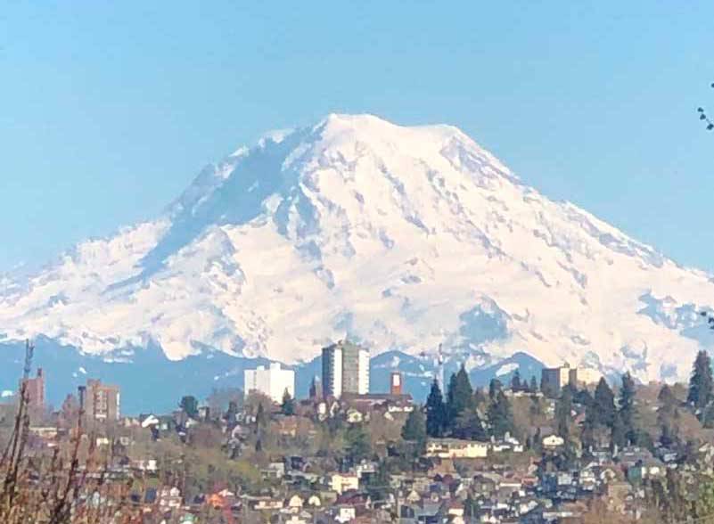 The mountain can be seen in the distance from Seattle. It hovers over Tacoma. (Photo by Morf Morford)