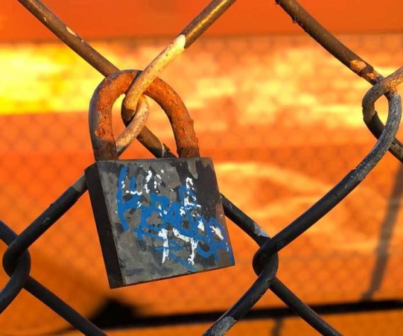 <p>Much resistance to change is about as productive as this lock on a chain link fence. (Photo by Morf Morford)</p>