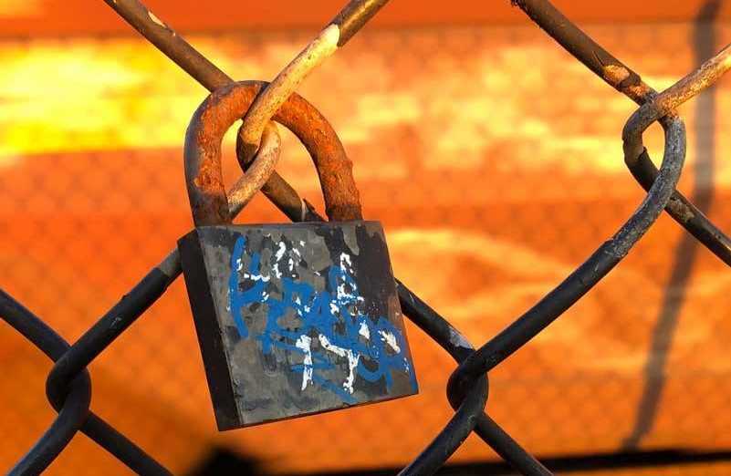 <p>Much resistance to change is about as productive as this lock on a chain link fence. (Photo by Morf Morford)</p>