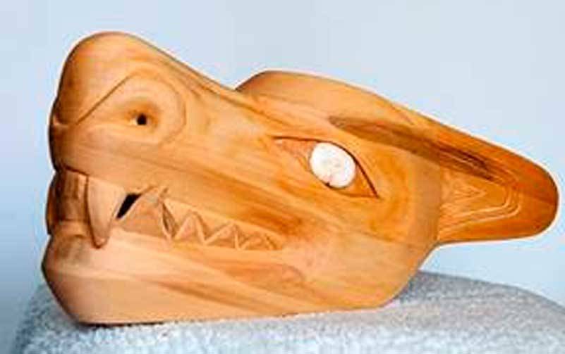 Image courtesy TAM / Othniel A. Oomittuk Jr. (Inupiaq), Wolf head dress, 2021. Alaskan yellow cedar, ivory, baleen, 8×6½×18½ inches.